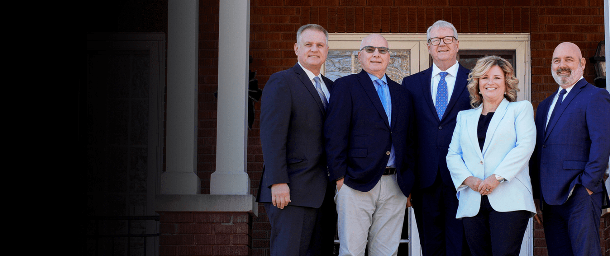 West Virginia Business and Personal Injury Lawyers from Shaffer & Shaffer standing side by side: Todd Mount, Tony Cicconi, Chip Shaffer, Sabrena Gillis and Rich Walters.