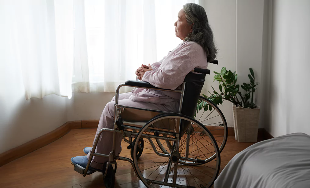 Woman in a wheelchair at a nursing home